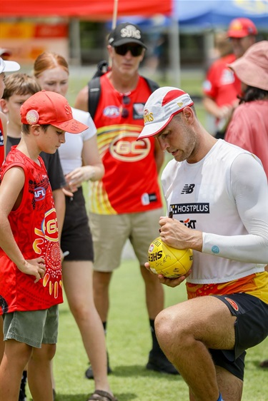 Player signing a football